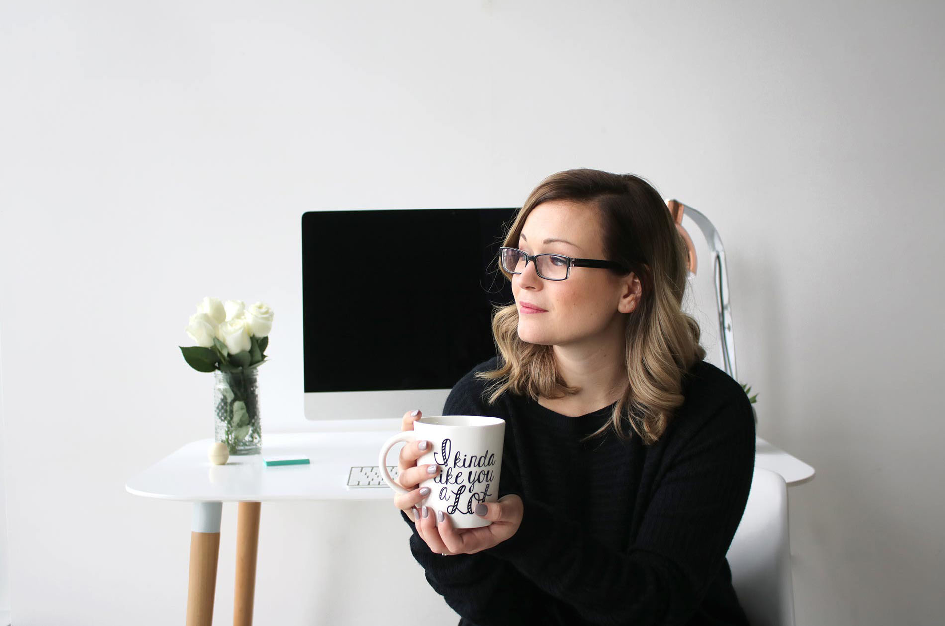 Holding a cup of coffee