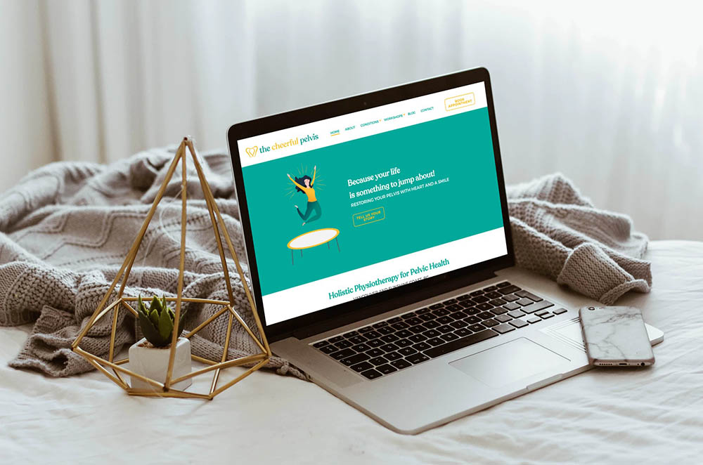 Cheerful pelvis website shown on a laptop - White Canvas Design