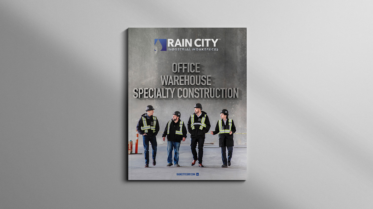 Front cover of Rain City pamphlet, a group of workers walking - White Canvas Design