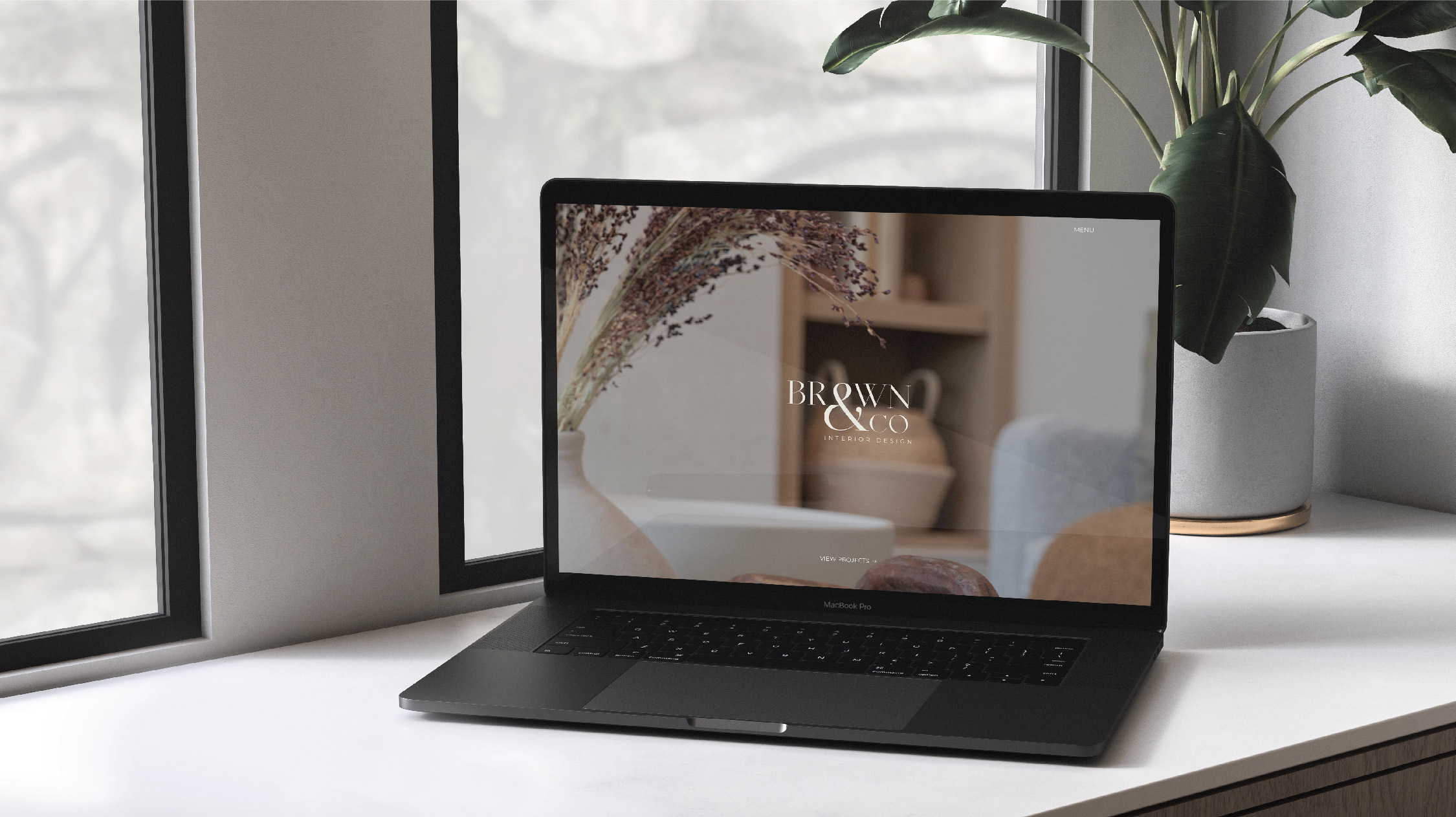 Brown & Co home page view on a laptop – by White Canvas Design