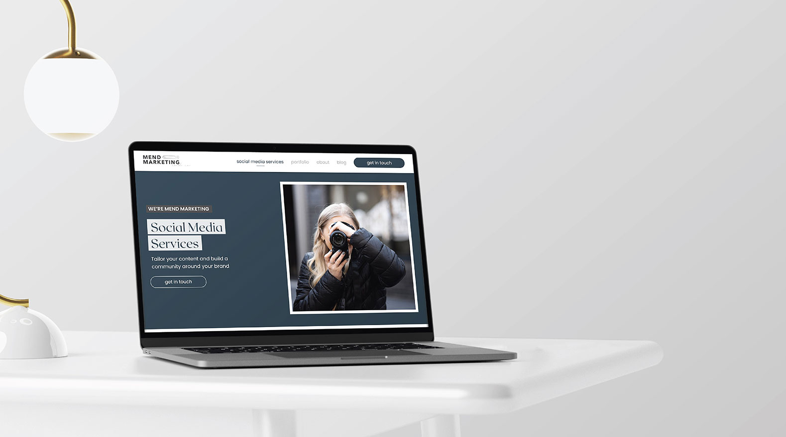 Mend Marketing website design, laptop view – by White Canvas Design