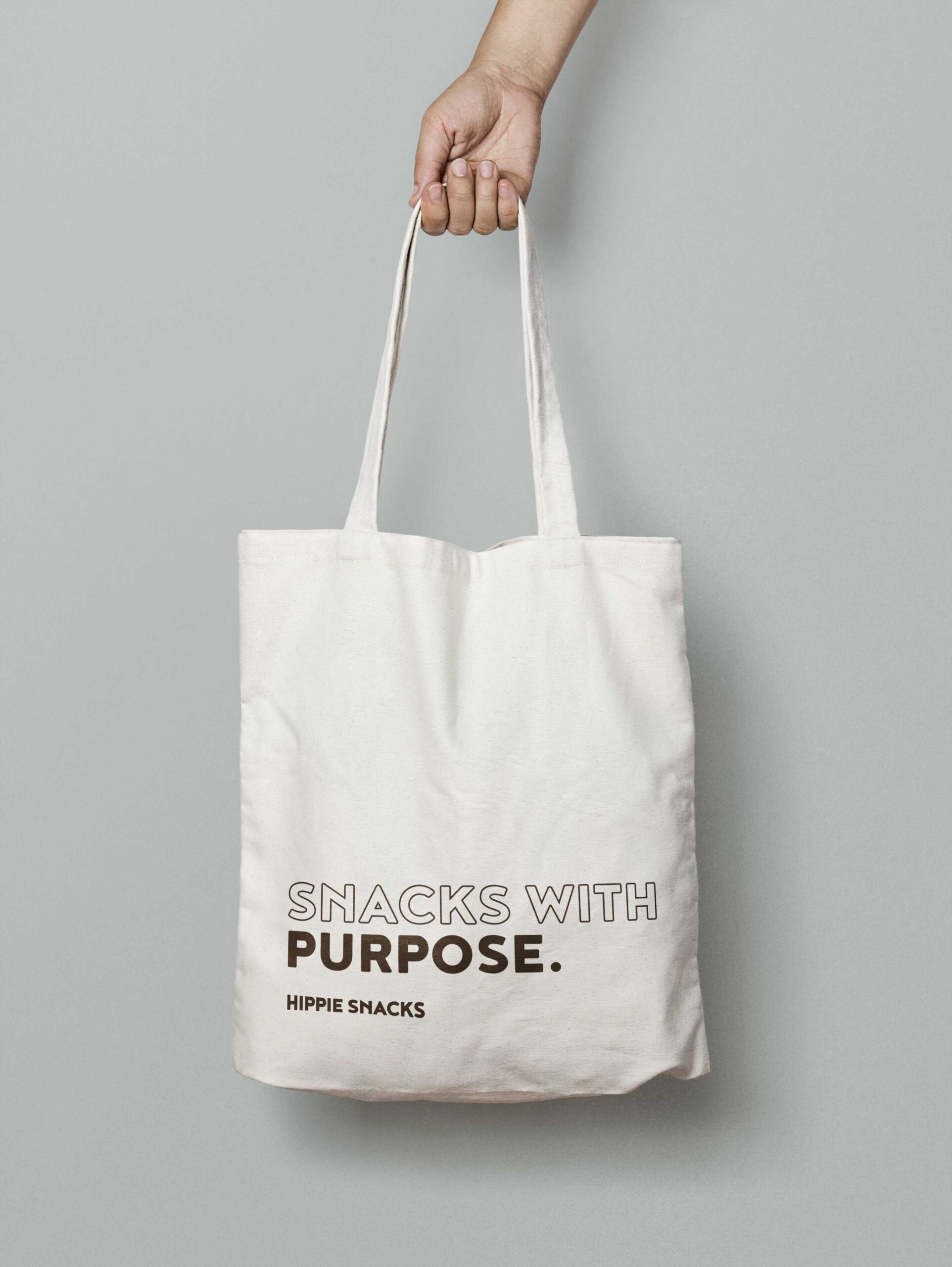 A mockup of a tote bag with graphic design elements