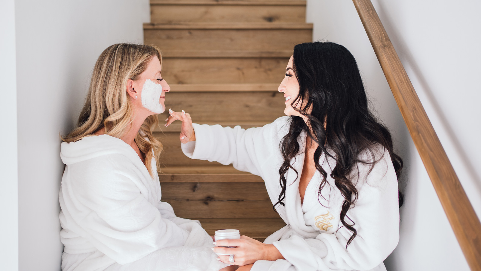 EOL branded photography two women using the EOL skincare products