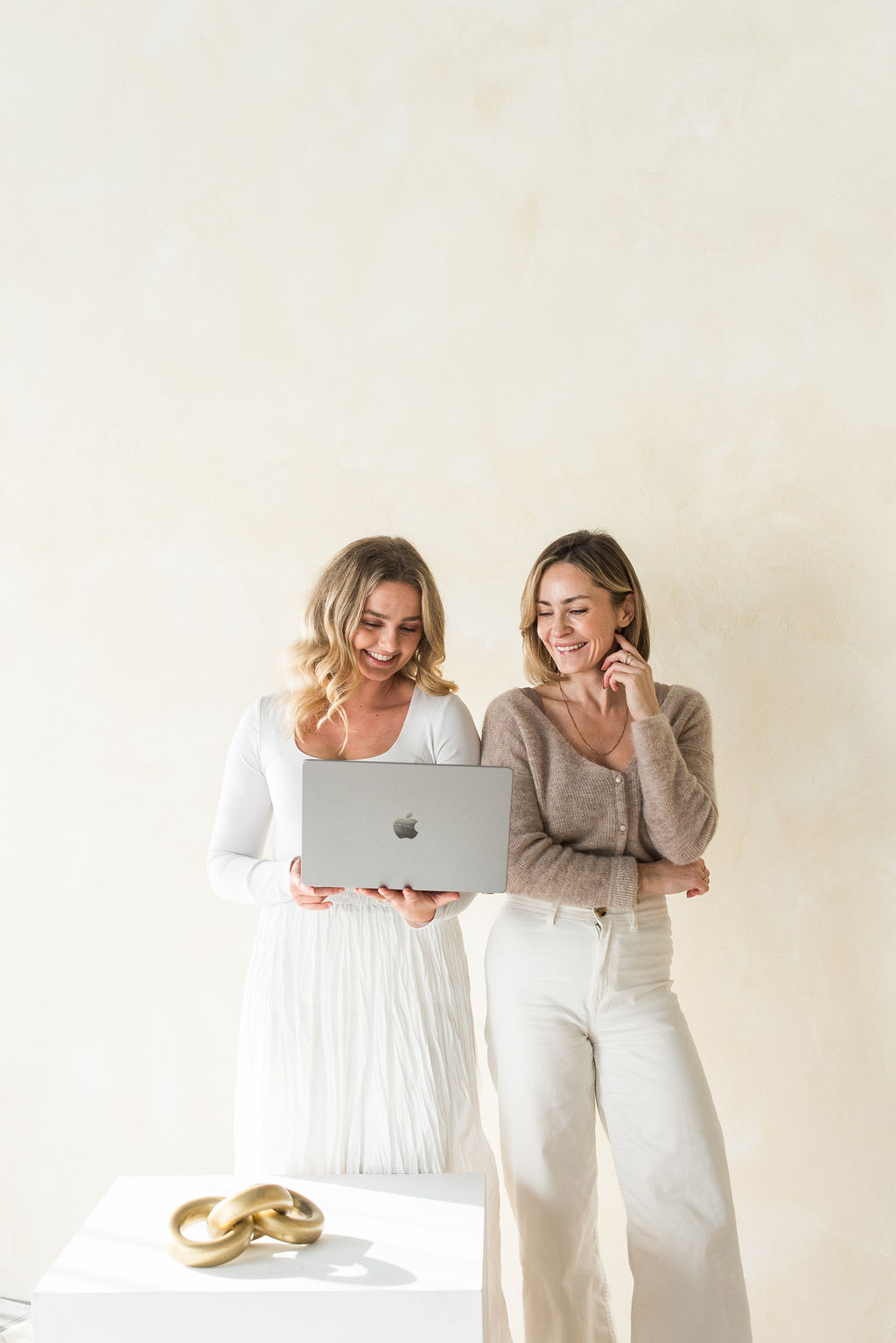 Delaney and Tania looking at a laptop