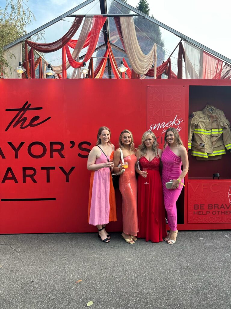 Four white canvas design employees attenting the Ignite the Night Mayors Party Charity event